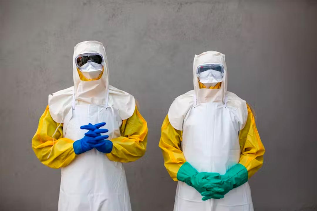 Staff from South Sudan’s Health Ministry pose with protective suits during a drill for Ebola preparedness. Credit: PATRICK MEINHARDT/AFP via Getty Images