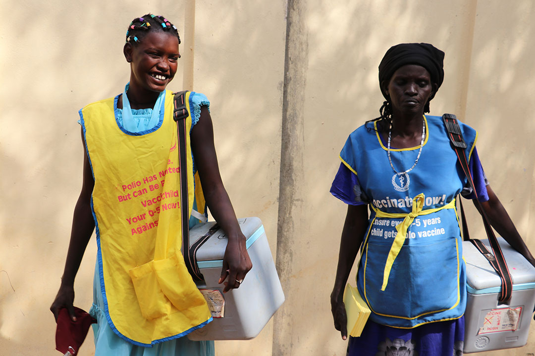 Vaccinators on their way to a session. Photo credit: WHO