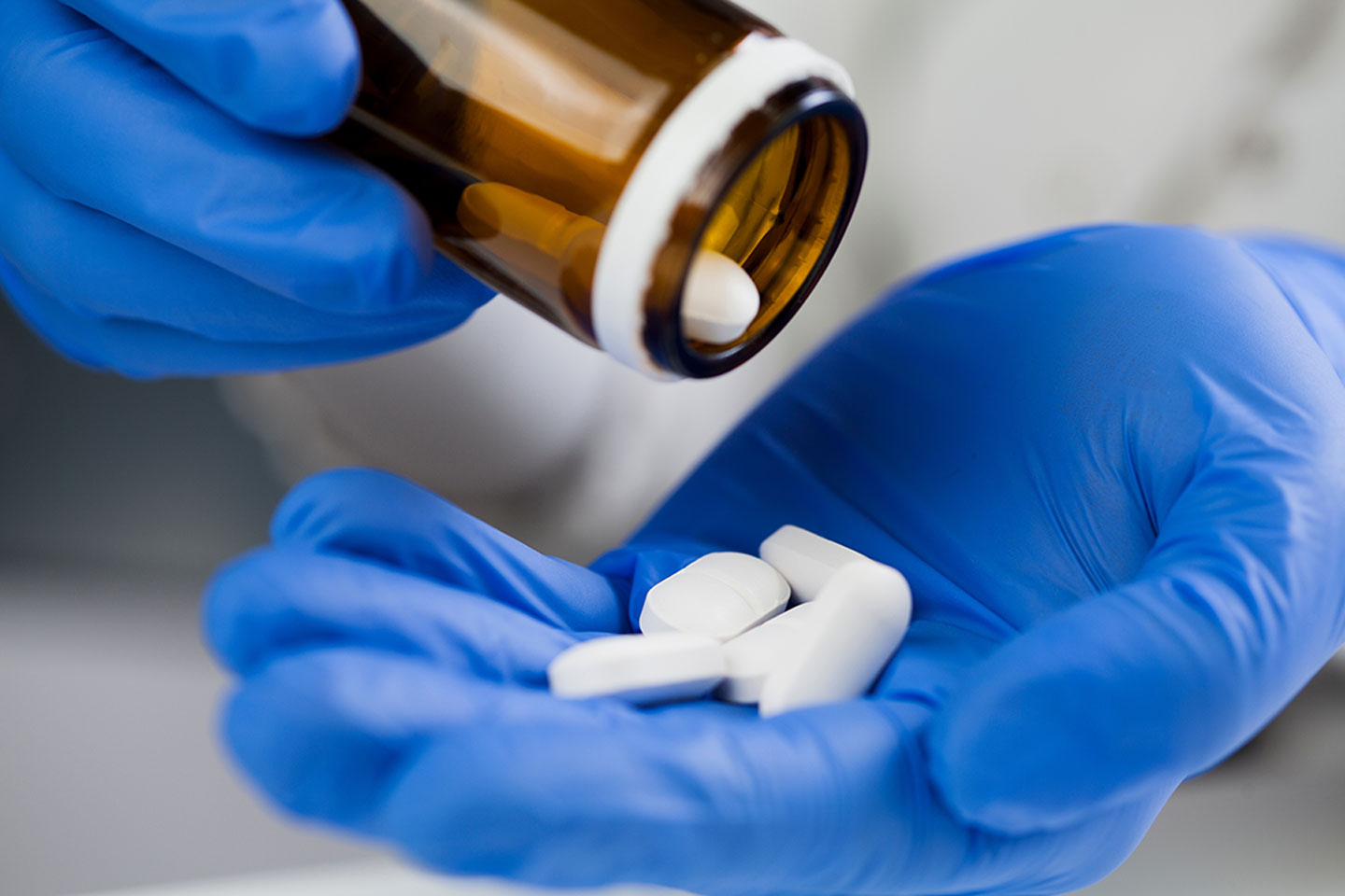 Closeup of antiviral pills. In recent months, several oral antiviral drugs have also been approved, which, if given early enough, appear to significantly reduce hospitalisations.