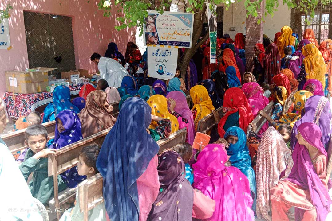 Flood affected women waiting for polio drops administration at Health Special Health camp of Rajanpur. Credit: ministry of National Health Services Regulations and Coordination