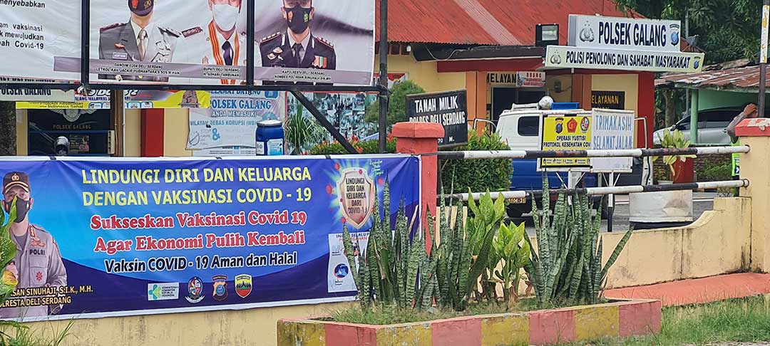 Vaccination poster in local police headquarter in Galang, North Sumatra. Credit: Dyna Rochmyaningsih