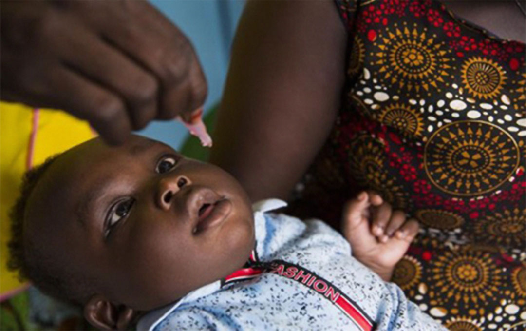 A child receives polio vaccine in Bor Town, Jonglei State on 19 Decemeber 2021. Photo credit: WHO