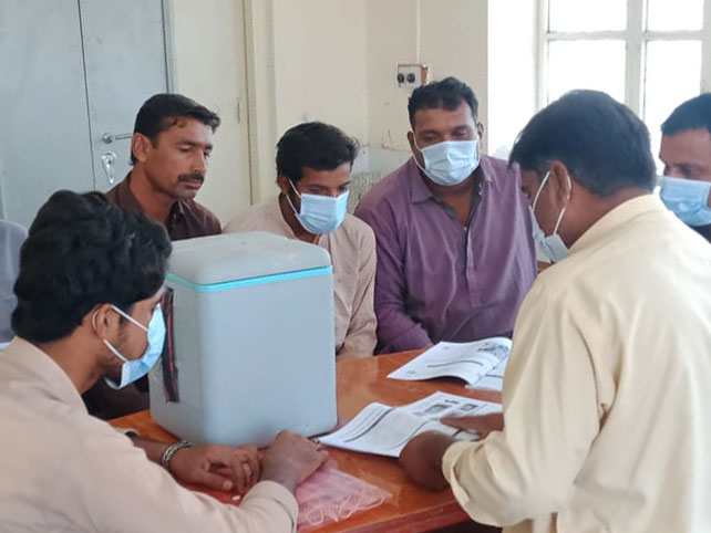 A group of polio workers in Balochistan waiting for security guards before starting their duties. Photo credit: Saadeqa Khan