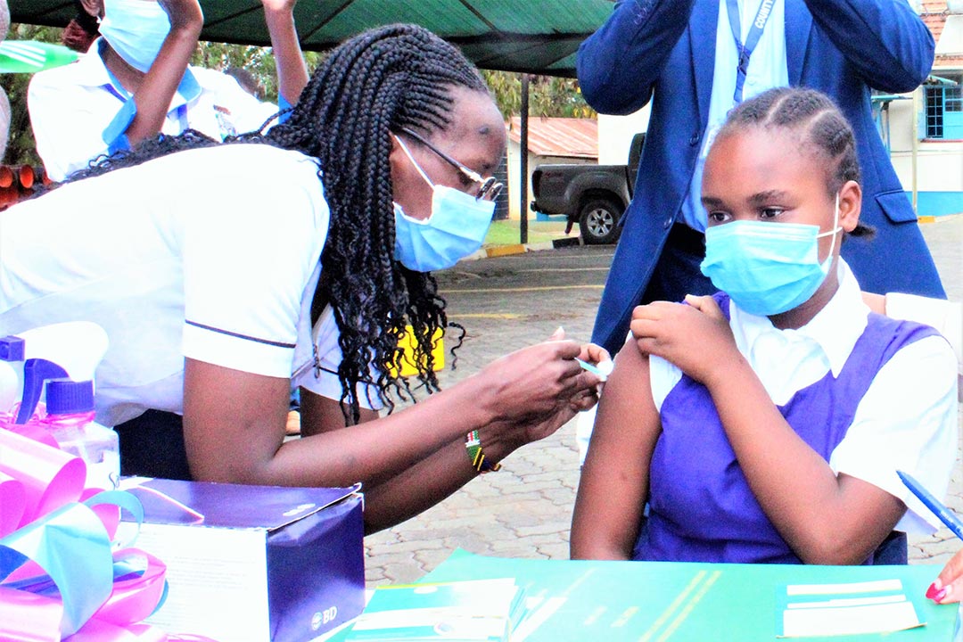 A school girl getting vaccinated against HPV