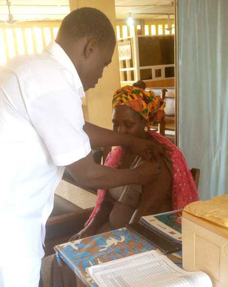 A resident of Cape Coast gets vaccinated at the Ewim Health Centre. Credit: Kwame Appiah