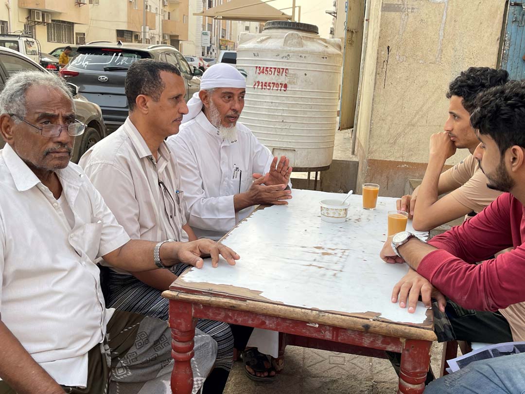 Dr. Nabeel (third from left) speaking with male members of a local community on the benefits of vaccination for children’s health and well-being. Photo: © UNICEF Yemen
