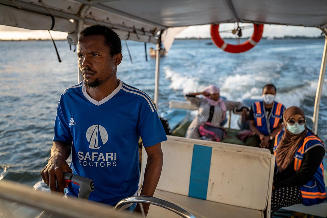 Carrying precious cargo including COVID-19 vaccines and other medical supplies, Safari Doctors’, Captain Fahmi, steers the Mama Daktari boat to the remote communities in the Lamu Islands. Credit: Jim Koenigsaecker