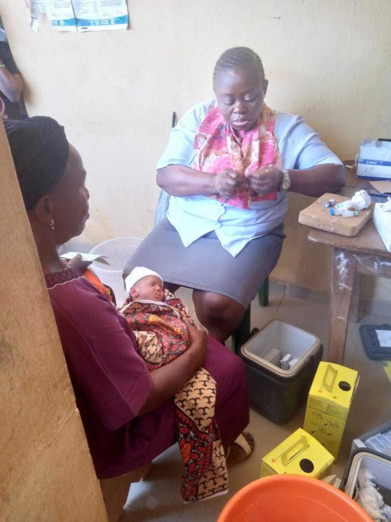 CHEW Edith attending to baby Diven Obinna. Credit: Chioma Obinna