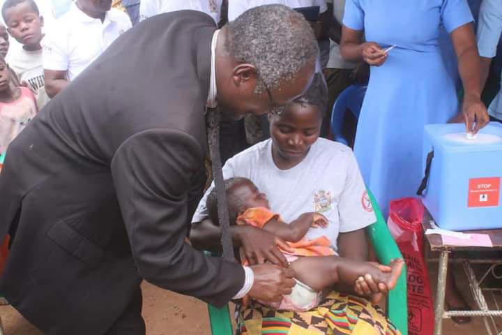 Secretary for Health, Dr Charles Mwansambo, administers the first malaria vaccine at the launch in Salima District. Credit: MoH