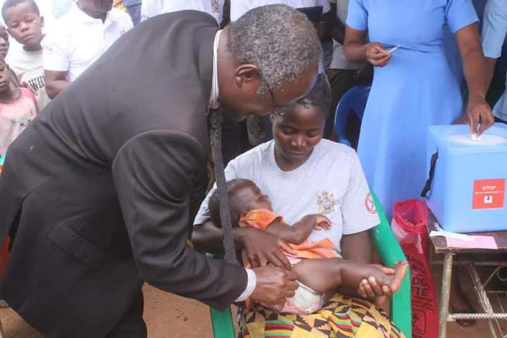  Secretary for Health, Dr Charles Mwansambo, administers the first malaria vaccine at the launch in Salima District. Credit: MoH