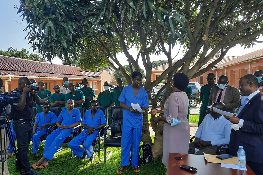 Dr Jane Ruth Aceng, minister of health in Uganda giving a discharge certificate to one of the health workers after he healed from Ebola at Entebbe Isolation facility. 10 health workers have contracted the Sudan Ebolavirus while only five have survived. Credit: Emmanuel Ainebyoona, Ugandan Ministry of Health