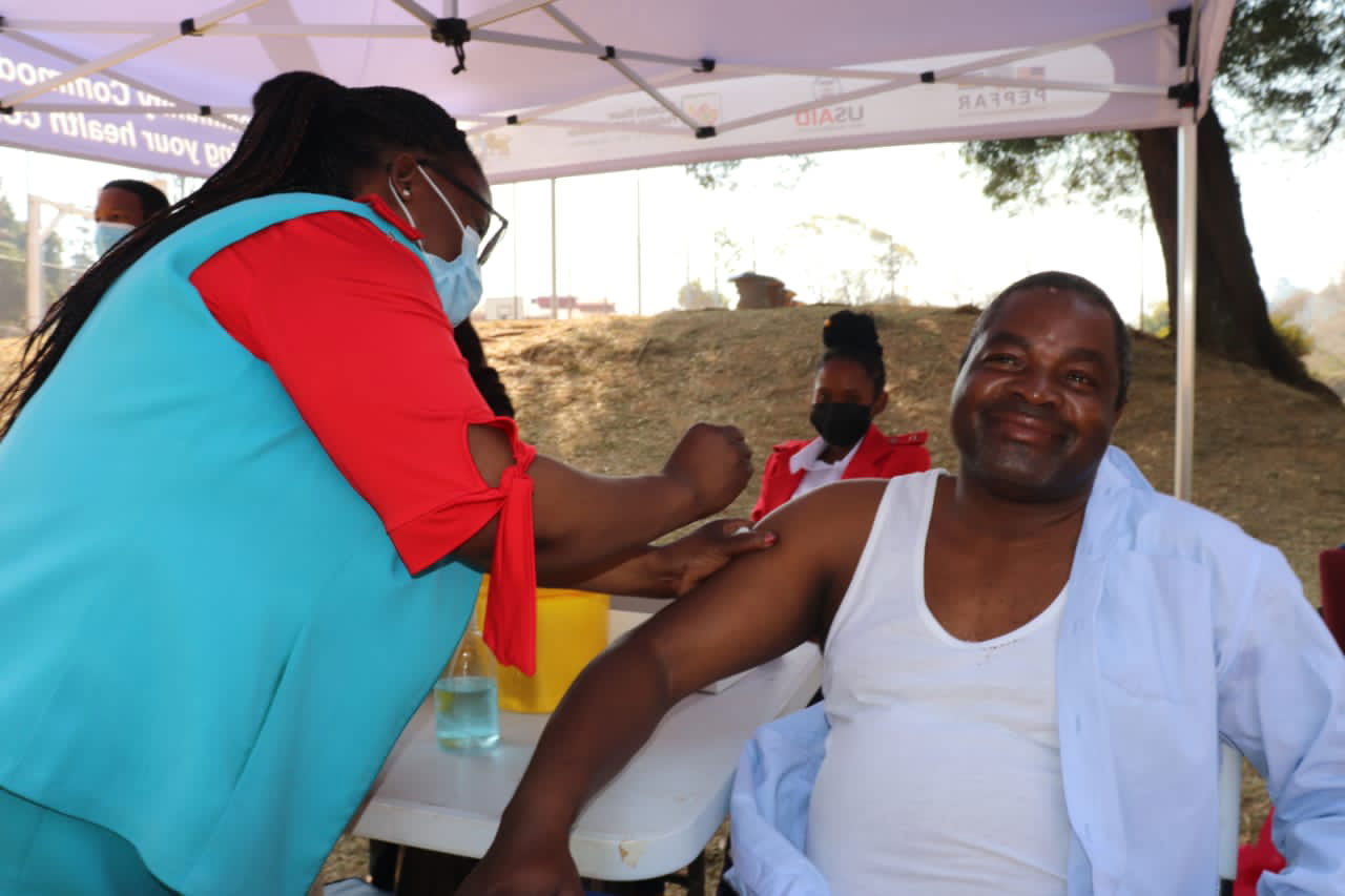 Bishop Mavovo Mkhontfo a member of the League of Churches taking a vaccine. Credit: Nomthandazo Nkambule