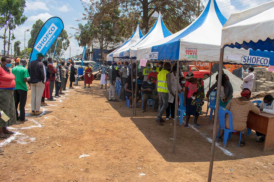 Kibra residents queue for COVID-19 vaccines.