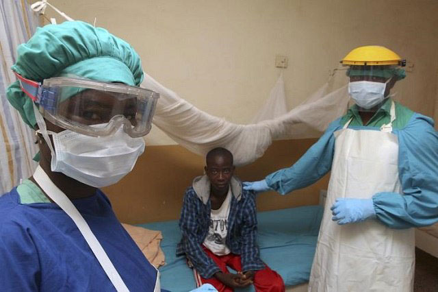 Medical workers treating a Lassa fever patient. Credit: Guardian Nigeria