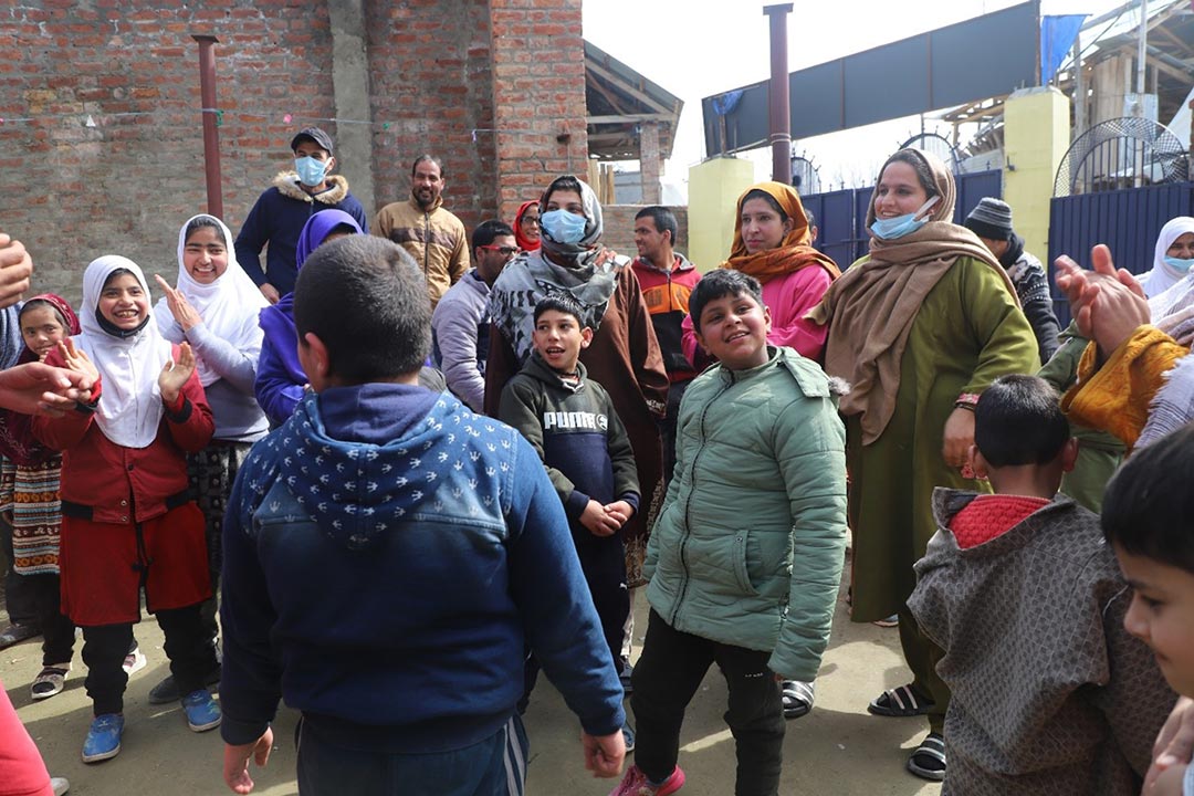 Members of the disability organisation, who also serve as the teachers, seen playing with students on Saturday, as schools opened in Kashmir after a long break due to COVID-19. Photo Credits: Kaleem Geelani