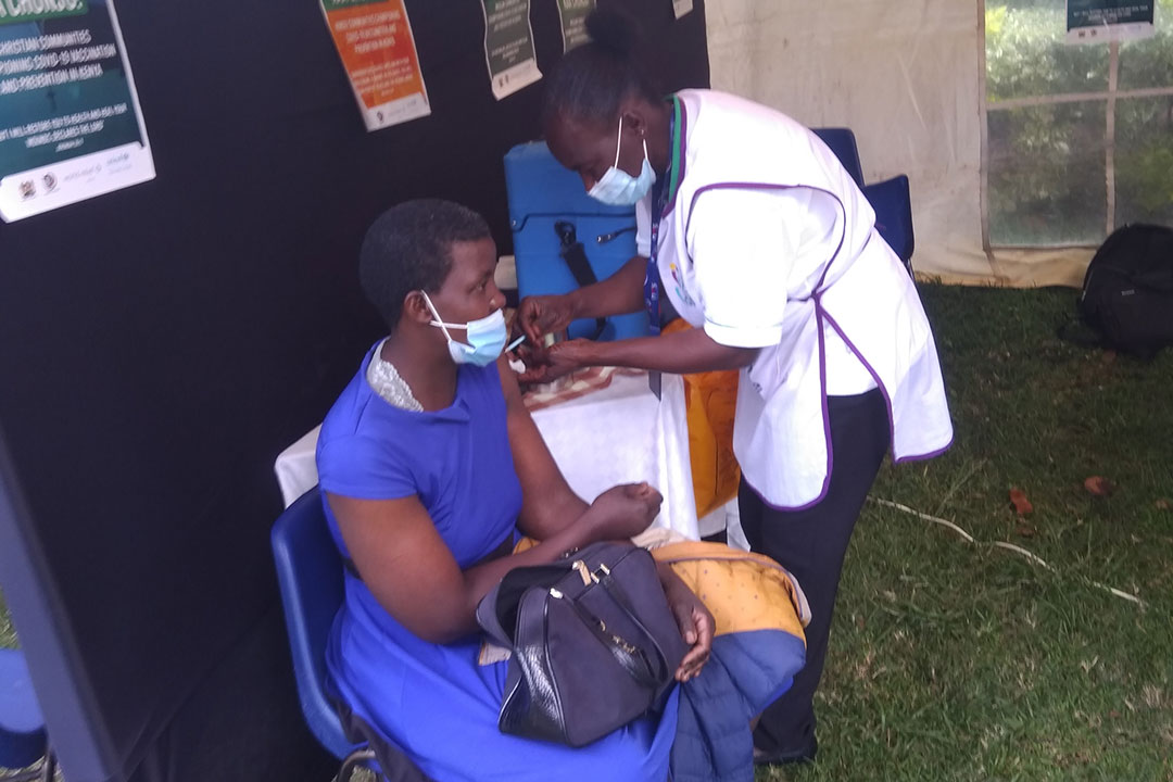 Ms Linet Khatambi, 35, receives her first COVID-19 vaccine during the vaccination drive by religious leaders held at Nairobi's Ufungamano House