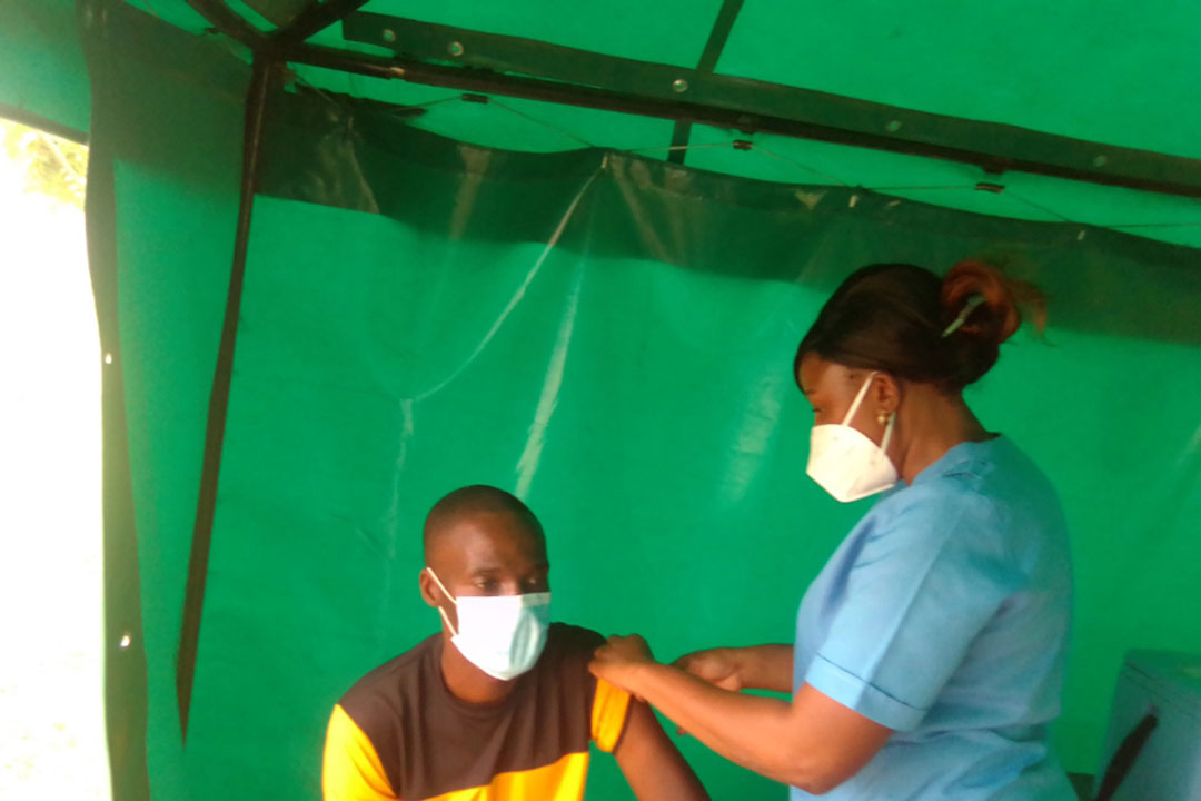 Nurse Chipo Chapfika vaccinates a patient in Chitungwiza