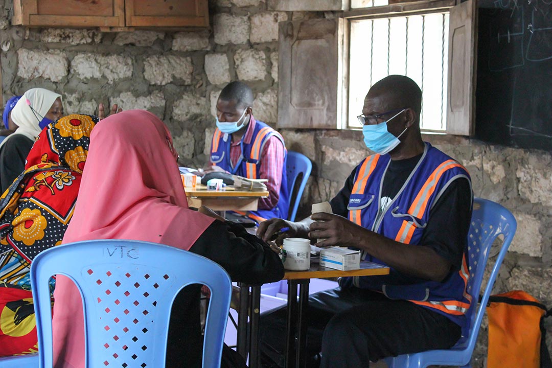 Nurse Harrison Kalu attends to a patient on Pate island. Credit: Shanga Nzole