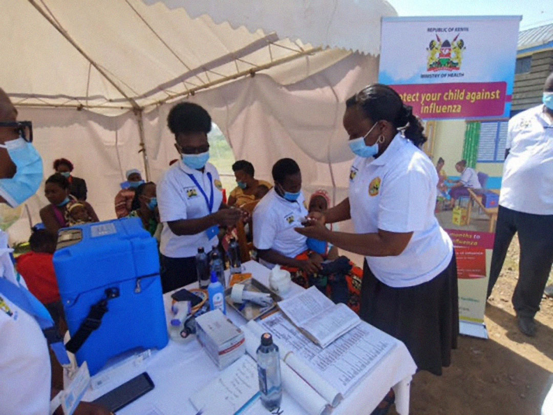 Nurses Liz Mwashumbe and Joan Mwongela offer Influenza vaccines to kids in Jomvu Sub-county, Mombasa County. Credit: Cyrus Michino