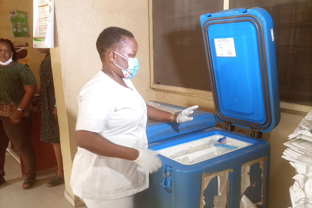Bukola Olowookere taking vaccines from storage
