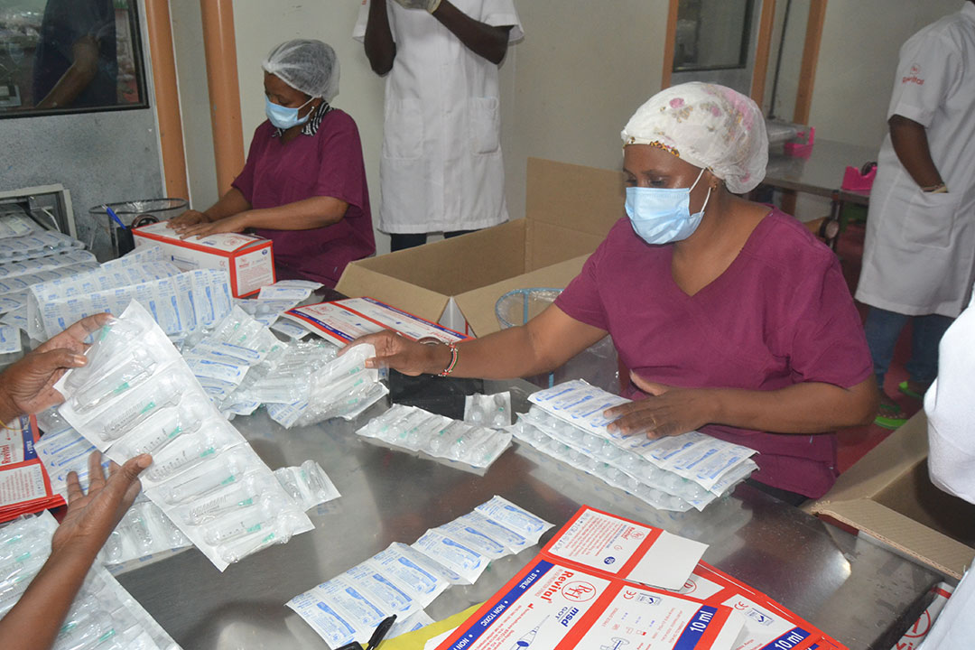 Revital workers inspecting packaged materials ready to be exported to Tanzania to fight the COVID-19 pandemic