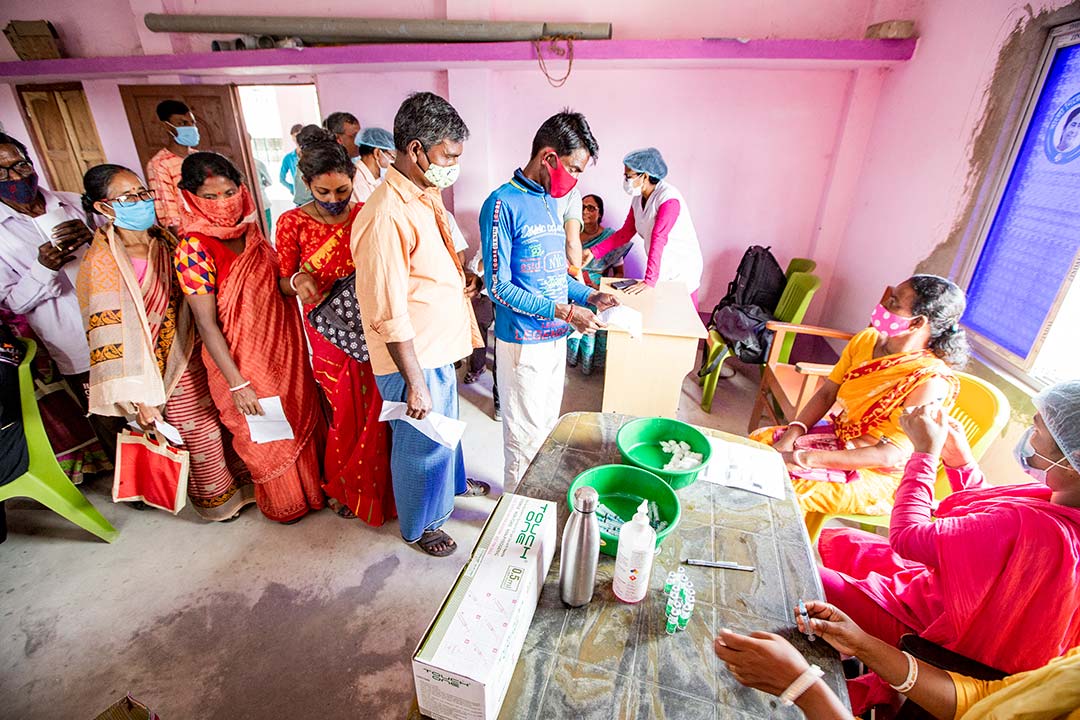 Villagers wait in line to get vaccinated with Covishield. Gavi/2022/Benedikt v.Loebell