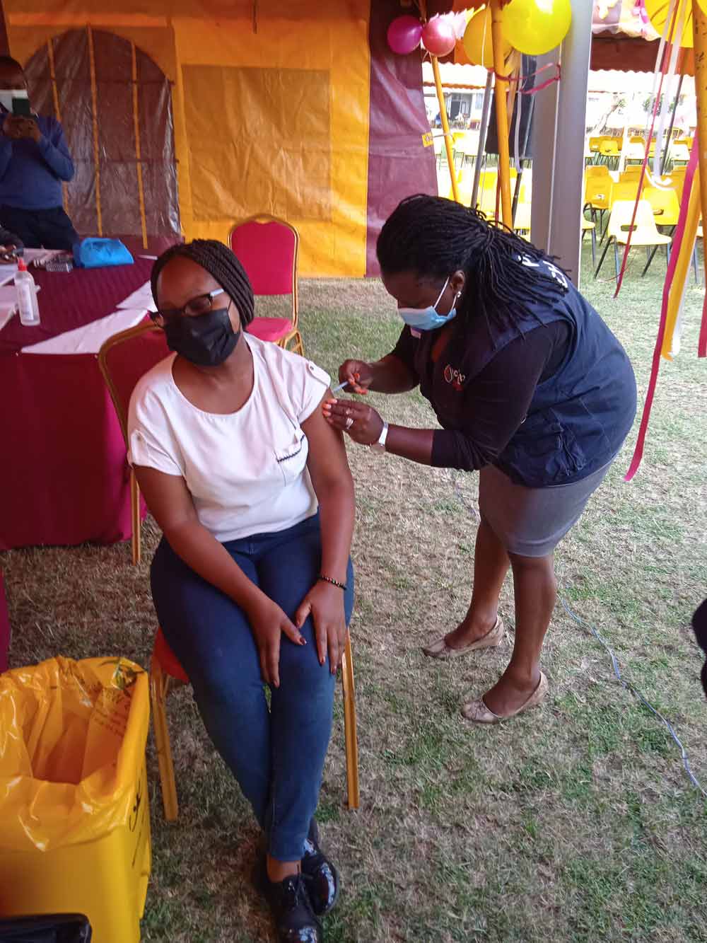 Tabby-Rotich-receives-her-COVID-19-booster-jab.jpg Nairobi-based Journalist Tabby Rotich receives her COVID-19 booster jab at the Kenya Medical Training College, Nairobi Campus. Credit: Mike Mwaniki.