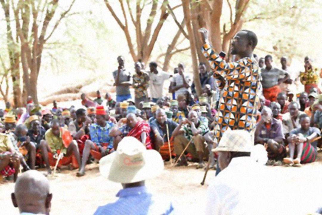 Turkana Governor, Josphat Nanok, addresses people on the importance of getting the COVID-19 jab in Loibonkare Village, Turkana County