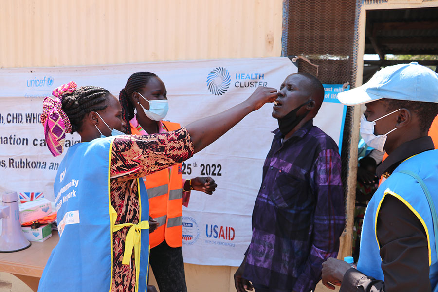 A vaccinator giving the oral cholera vaccine. Photo credit: WHO