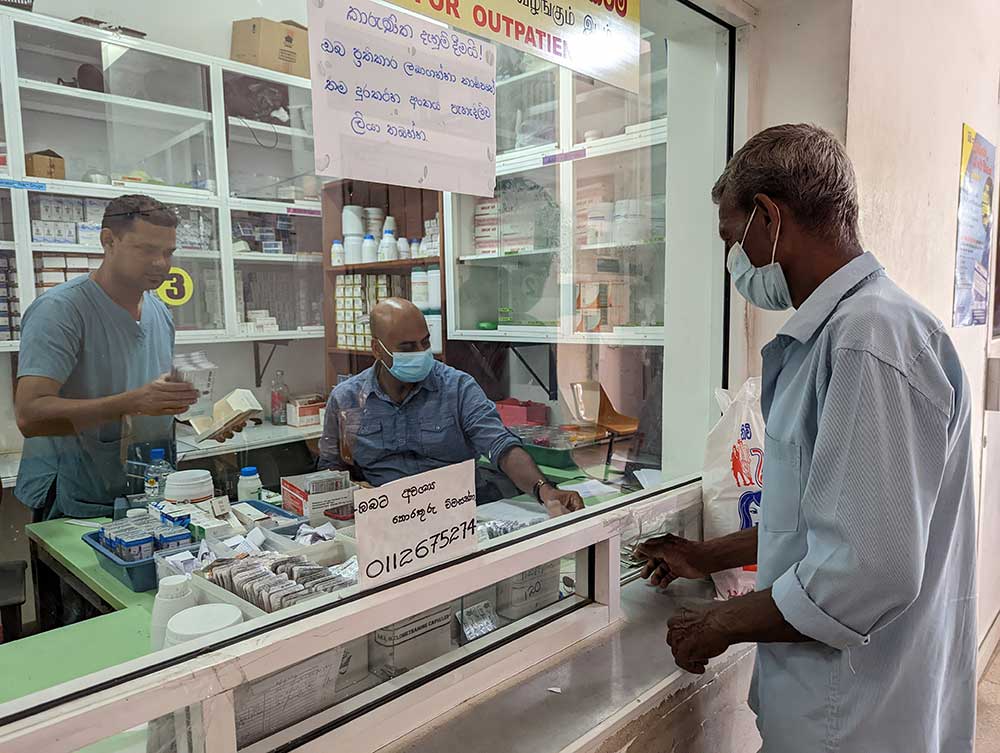 W. L. Nandasena receiving medication at the pharmacy in the Chest Clinic. Credit: Aanya Wipulasena