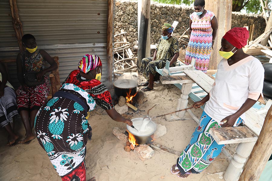 A woman visits a COVID-19 education session in Kilifi county, Kenya.