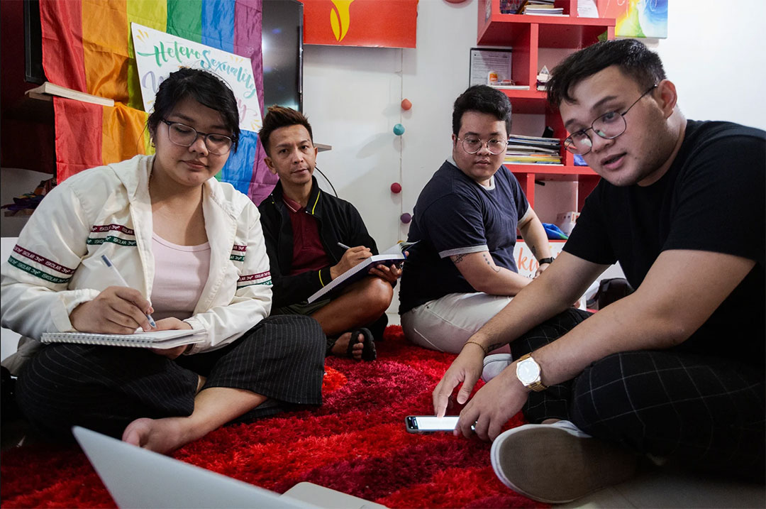 The crew and staff of Youth Voices Count Philippines participate in a hybrid meeting led by Executive Director Justin Bionat.