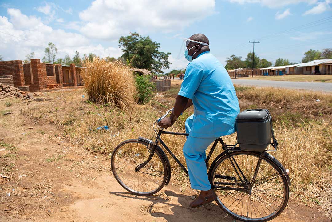heading out on a bicycle to provide vaccination services to the community.