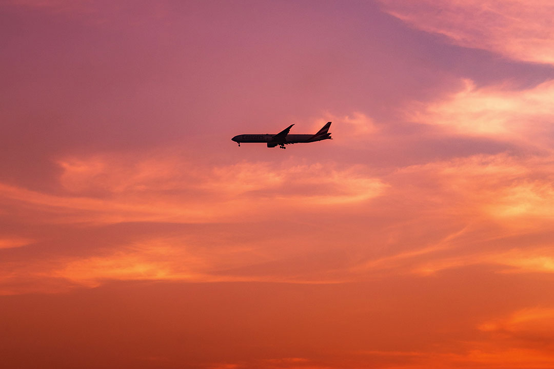 Plane in the twilight sky. Photo by Ramy Kabalan on Unsplash