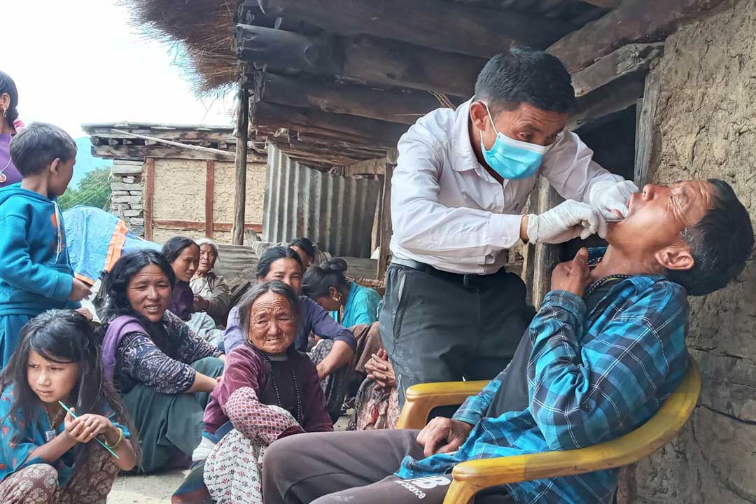 Bali Raj Budha, a public health inspector from Mugum Karmarong Rural Municipality, providing dental treatments at the Saturday Mobile Clinic. Credit: Chhorden Sangnu Lama