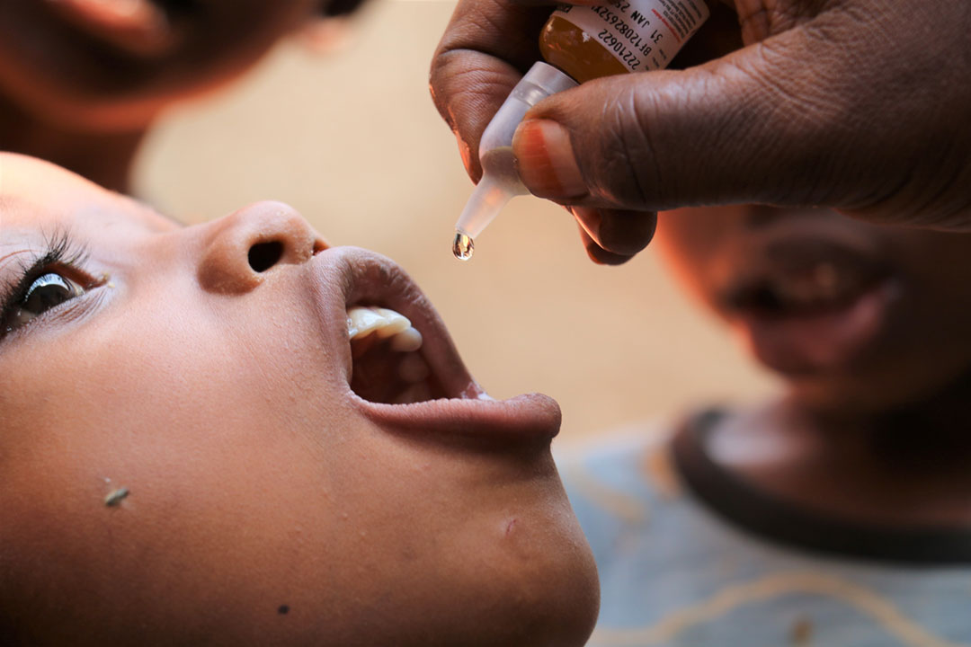 A child receiving polio drops. Credit: Moses Havyarimana