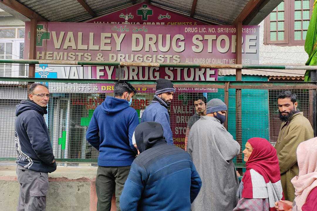 People que up to get medicine from a medical shop outside Chest Disease hospital in Kashmir. Credit: Nasir Yousufi