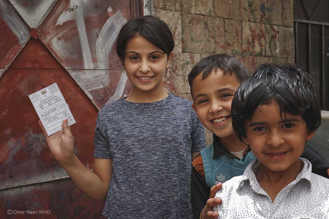 Children in Sana’a city holding immunisation cards. Credit: Omar Nasr/ WHO Yemen
