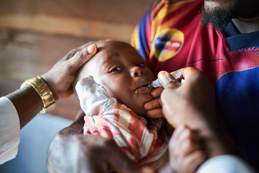 A child in Cameroon getting an oral vaccine. Credit: Gavi/2021/Christophe Da Silva