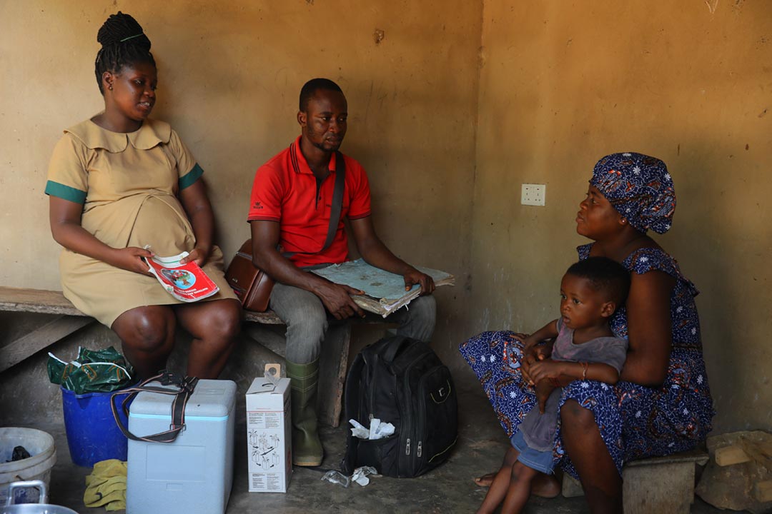 Health worker Awudi Felicia Akosua and volunteer Ernest Nabuel during a community visit in the Oti Region of Ghana. Healthcare workers visited families to provide vaccines to zero-dose children, including the Mosquirix vaccine (RTS,S) against malaria. Credit: Gavi/Nipah Dennis