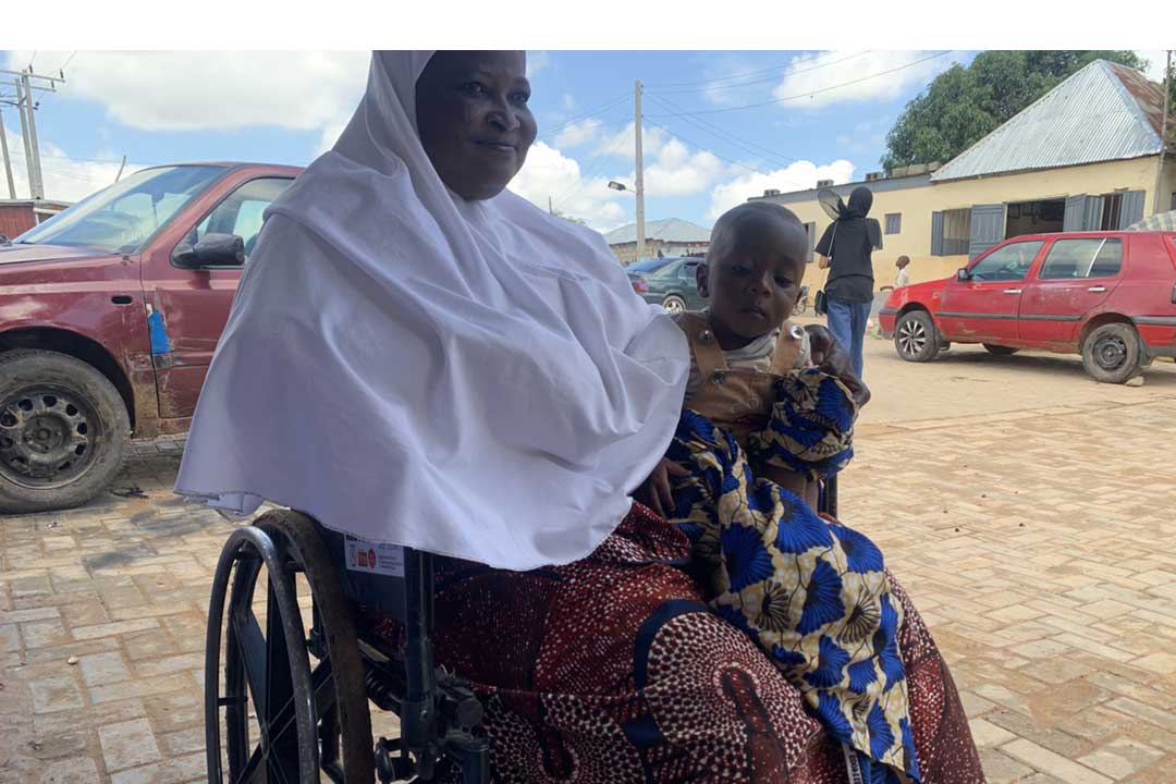 Rabi Ibrahim holding her eight month old son. Credit: Zubaida B Ibrahim