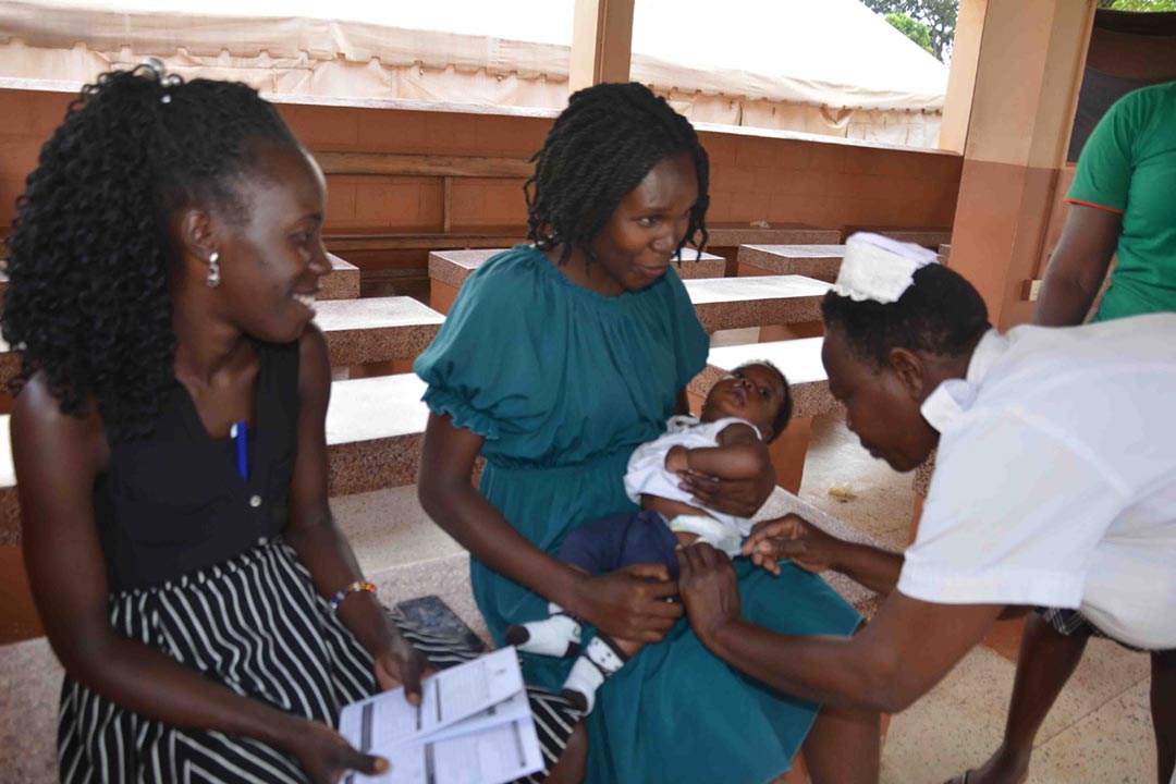Sister Goretti vaccinating infants at Lira referral hospital. Credit: Esther Nakkazi