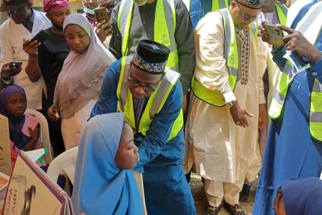 Bauchi governor administers the vaccine to a girl Credit: AsheNews