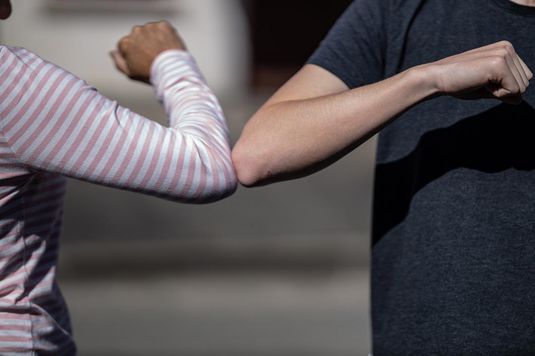 Elbow bump, a creative way to greet people during the COVID-19 pandemic. Credit: noahmatteo on Unsplash