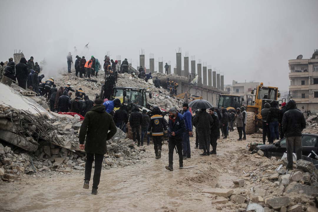 People on the ruins of collapsed buildings in Syria. Credit: Khaled Akacha on Pexels