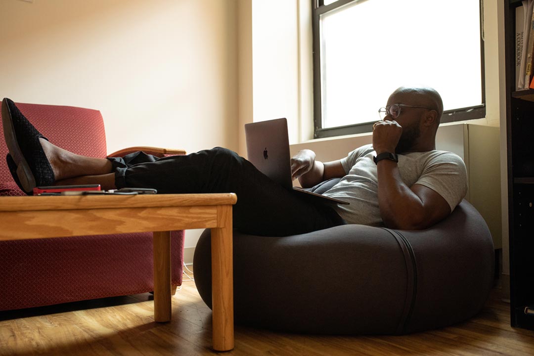 Relaxed man using his laptop. Credit: nappy on Pexels