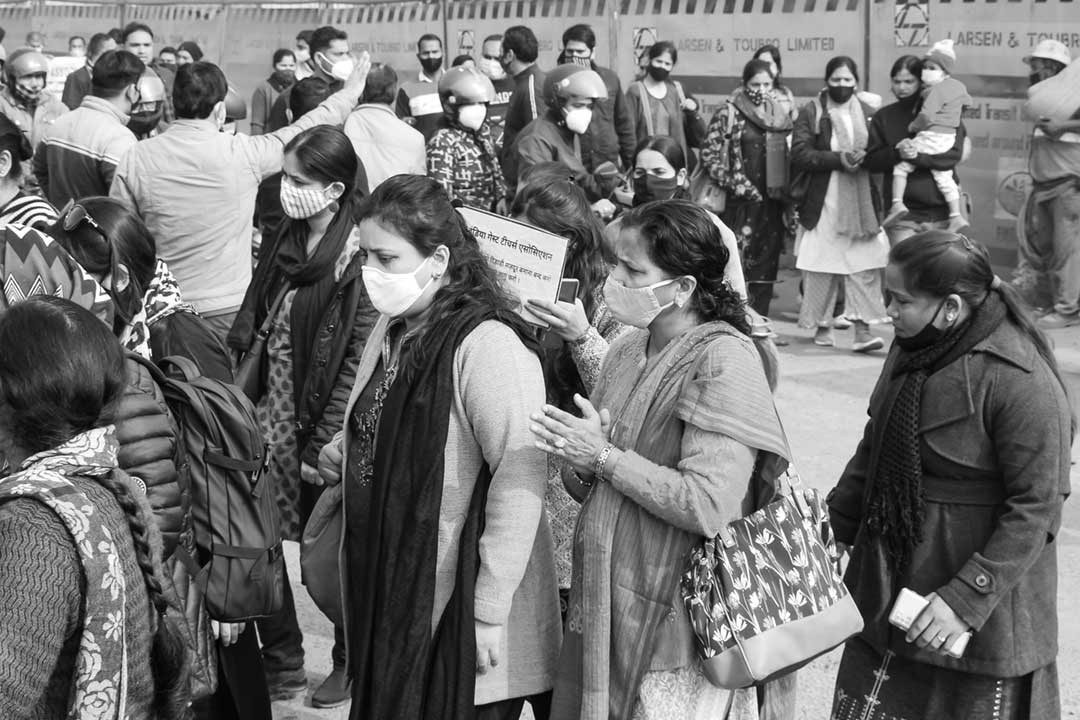 A crowd of people wearing protective face masks. Credit: Rahul Sapra on Pexels