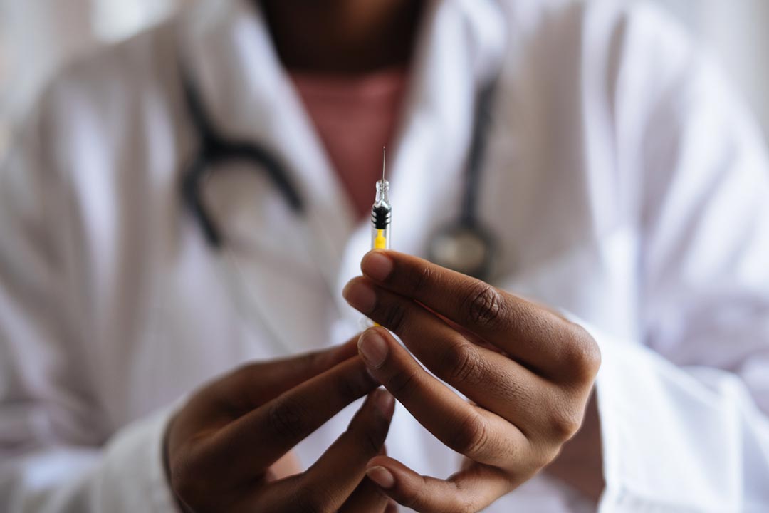 A doctor holding a prepared shot of vaccine. Credit: RF._.studio on Pexels