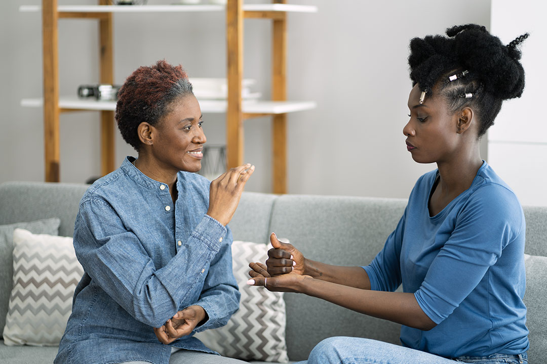 People communicating through sign language