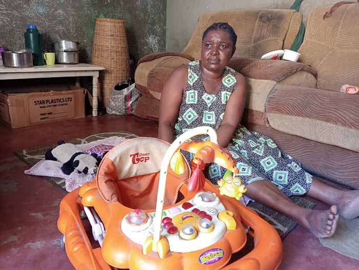 Beatrice Mwajuma seated inside her house which was also used as a day care in Mishomoroni in Mombasa. Credit: Diana Wanyonyi